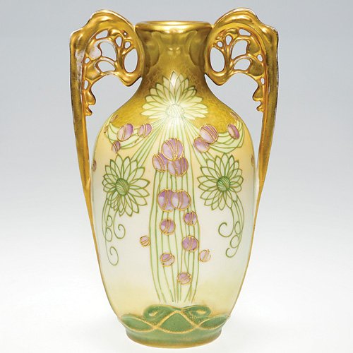 Amphora vase, R, St. & K. Dachsel design, 7 1/4": Amphora 7 1/4 inch vase with two ornate handles and a stylish, Art Nouveau floral decoration, a Paul Dachsel design. Marked with the Riessner, Stellmacher & Kessel logo. No crazing with some minor wea