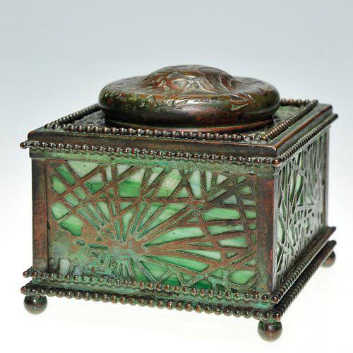 Tiffany bronze inkwell,3 1/2",insert,quill holder: Nice Tiffany Studios bronze ink well with green slag glass peeking through a reticulated conifer needle design. The well is lofted on ball feet, the circumference encircled with chains of beading. The