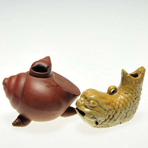2 Ceramic water droppers: snail & dolphin: Two ceramic water droppers. 1)Charming Snail resting on a trio of snails with a snail on top. Nice brown patina. Seal impression on the side. Height 2 inches, length 2 7/8 inches. Aged nicks. 2)Dolphi