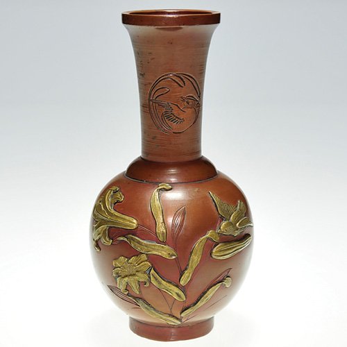 Japanese mixed metal vase, small bird: Japanese brass and copper vase with the applied design showing a small flighted bird visiting a group of flowers. Hand engraving on the neck reveals a bird on one side and a pomegranate on the opposin
