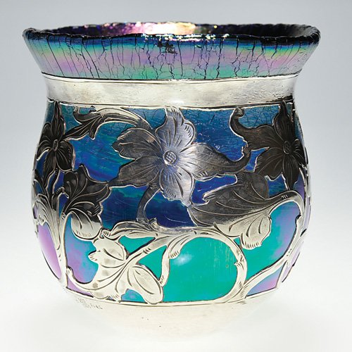Loetz attributed blue vase,silver overlay,5 3/8": Loetz attributed vase in iridescent blue with a flowering vine in silver overlay. Height 5 3/8 inches, diameter 5 1/2 inches. The silver is marked "S 999/1000 Fine." The glass is heavy and thick. The