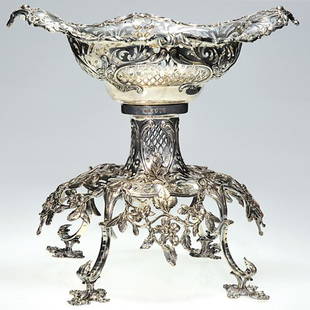 English silver center piece, 2 part, 12 inches: Impressive Victorian English silver two section center piece epergne by Daniel and Charles Houle. The oval basket having pierced open work, the rim flourished with acanthus foliage and scrolls. Measur