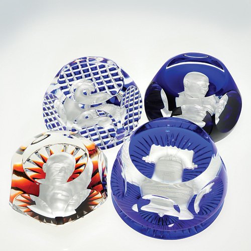 4 assorted Baccarat paperweights, lgst 3 5/8": Four Baccarat sulphide cameo paperweights, each stamped with the firm's circular logo. 1) Adlai Stevenson portrayed against a red brown ray backdrop. Designed by French sculpture Albert David. Leaflet