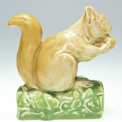 Rookwood 4" Squirrel paperweight, polychrome: Squirrel paperweight, a Sallie Toohey design, cast in 1928 and colored in naturalistic tones of brown and green mat glazes. Impressed with the Rookwood logo, the date, shape 6025 and the designer's mo