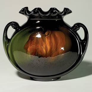 Roseville Rozane Royal Dark 9" , Leffler, lion; bas: Roseville Rozane Royal Dark 9 inch by 11 inch pillow vase with ruffled rim and two handles, decorated by Claude Leffler with the portrait of a lion. The kingly vase is stamped "RPCo Rozane 882 L" and