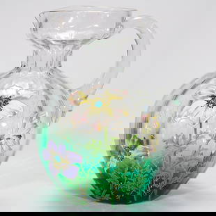 Moser-type pitcher, enameled poppies, 8 1/2: Pitcher in the style of Moser with ribbed body shading from clear to emerald green. The 8 1/2 inch body is decorated with large poppies in pink and purple. There is a nearly invisible heat check at