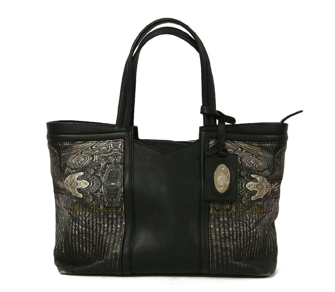 An Etro black leather shopper-style tote handbag: An Etro black leather shopper-style tote handbag,with white printed marble design, silver-tone hardware, zip closure, lined in orange Etro fabric, sectioned interior, with dust bag