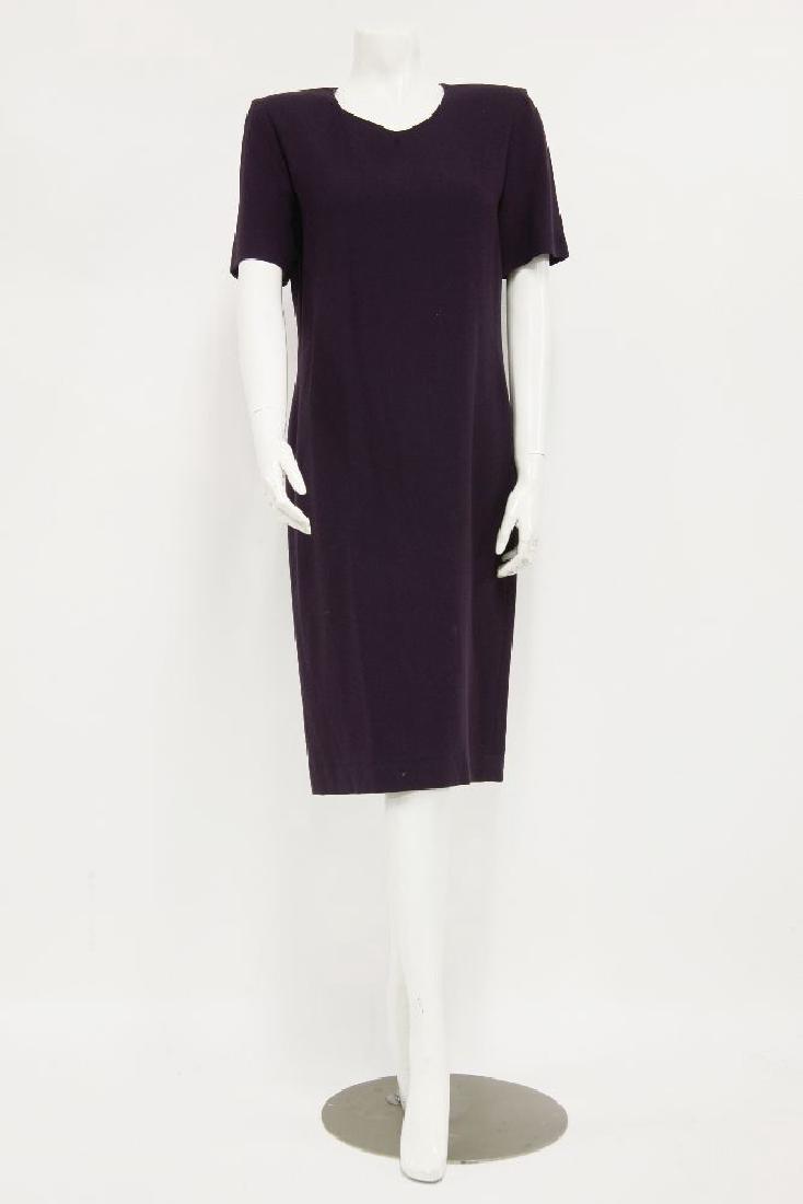 A collection of vintage textiles to include: a: A collection of vintage textiles to include: a Valentino navy dress with bow detail to front, an Yves Saint Laurent green jacket with scalloped hem, A purple wool crepe Jean Muir dress (qty.)