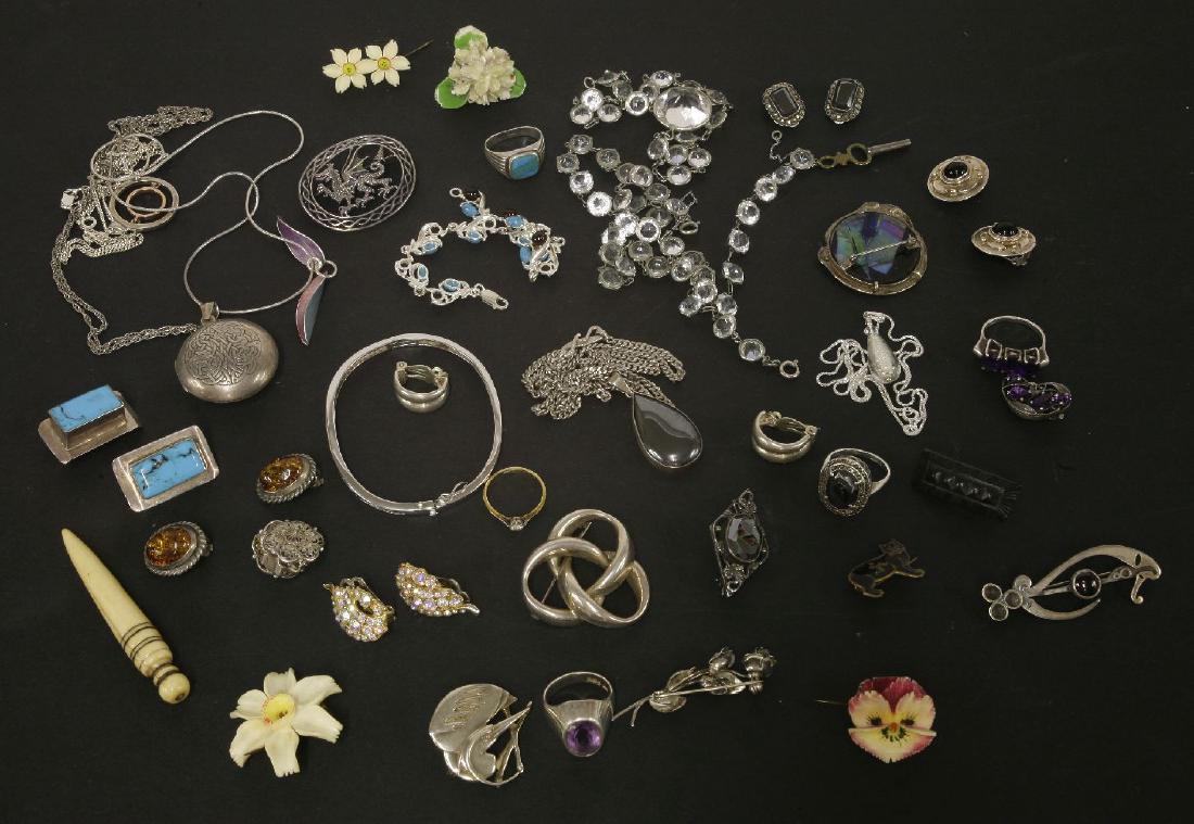 A Clogau gold sterling silver and Welsh gold two-row: A Clogau gold sterling silver and Welsh gold two-row hoop pendant, an Arts and Crafts single earring attributed to Bernard Instone,with four graduated amethysts, claw set between incised leaves and te