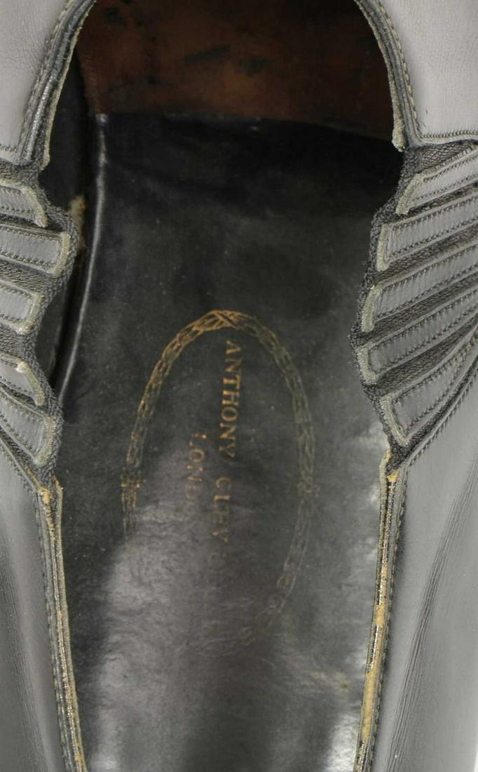 A pair of beige slip-on shoes,: A pair of beige slip-on shoes, A pair of beige slip-on shoes, with gold-tone detailing, a pair of Anthony Cleverley black leather shoes, with trees, and a pair of brown leather loafers (8)