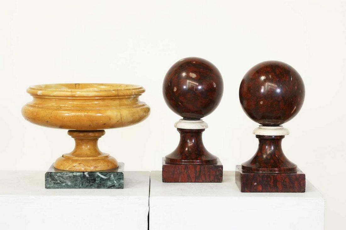 A pair of Rouge Griotte marble balls, (1 of 4)
