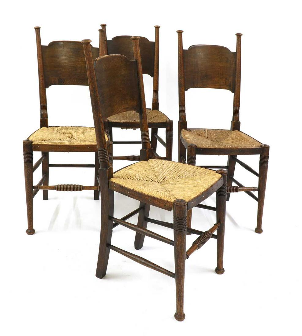 A set of four oak and rush-seated chairs, (1 of 2)