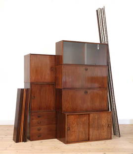 A Danish rosewood modular wall system,: § A Danish rosewood modular wall system, designed by Rud Thygesen and Johnny Sørensen, and manufactured by Hansen and Goldborg HG Furniture, comprising: seven glass-fronted cabinets, 89.5cm
