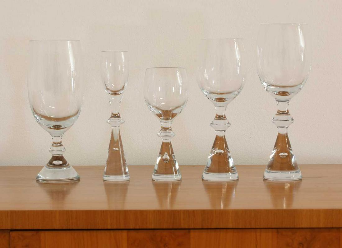 A suite of Danish Holmegaard glassware,: A suite of Danish Holmegaard glassware, comprising five different sizes of twelve, including red wine glasses, white wine glasses, dessert wine glasses, liqueur glasses, and beer glasses, 14.5, 16.5,