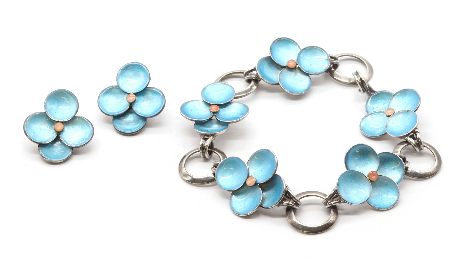 A silver enamel bracelet, by Bernard Instone,: A silver enamel bracelet, by Bernard Instone, A silver enamel bracelet, by Bernard Instone, with blue and pink enamel floral links joined by circular silver links, to hook clasp, marked B.I SILVER, 19