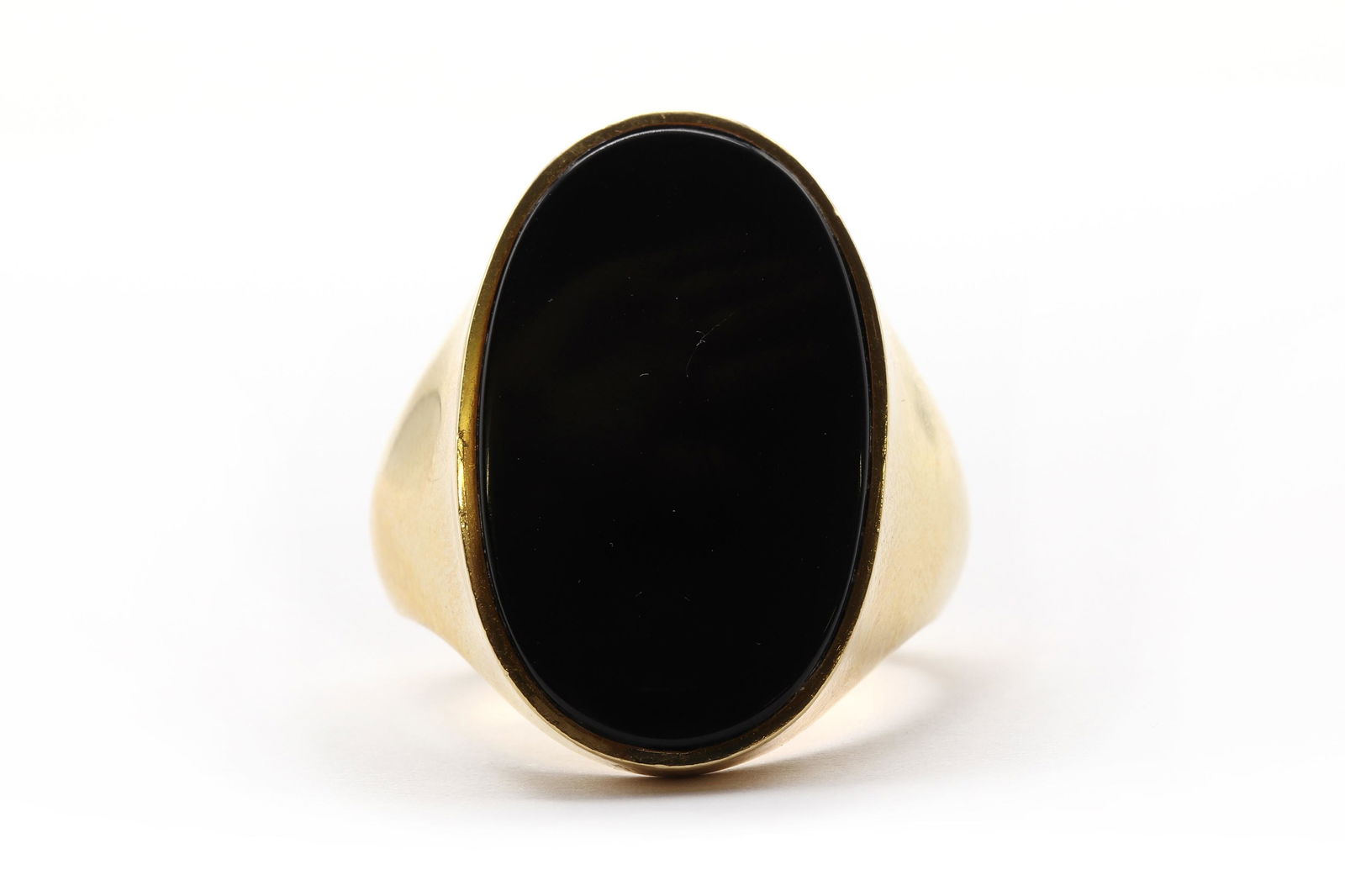 A large gold onyx ring, (1 of 3)