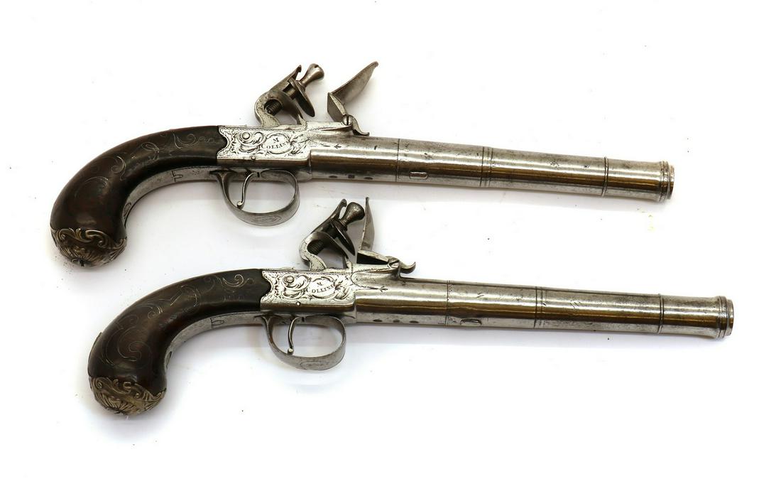 A pair of flintlock boxlock cannon barrelled pistols by M Collins, Dublin (1 of 2)