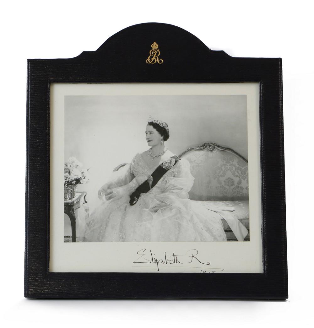 A signed photograph of HM Queen Elizabeth, the Queen Mother,: A signed photograph of HM Queen Elizabeth, the Queen Mother, A signed photograph of HM Queen Elizabeth, the Queen Mother, a black and white portrait photograph by Cecil Beaton, signed to the mounts in