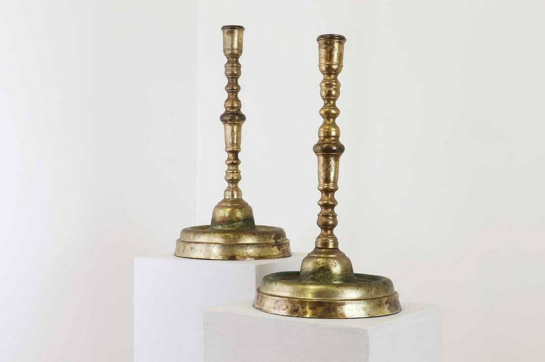 Two gilt-brass candlesticks, (1 of 7)
