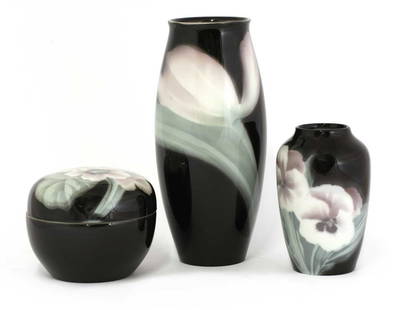 Three Rörstrand porcelain items,: Three Rörstrand porcelain items, Three Rörstrand porcelain items, c.1897-1910, by Algot Eriksson and Karl Lindström, each decorated with flowers, comprising two vases and a pot and cove
