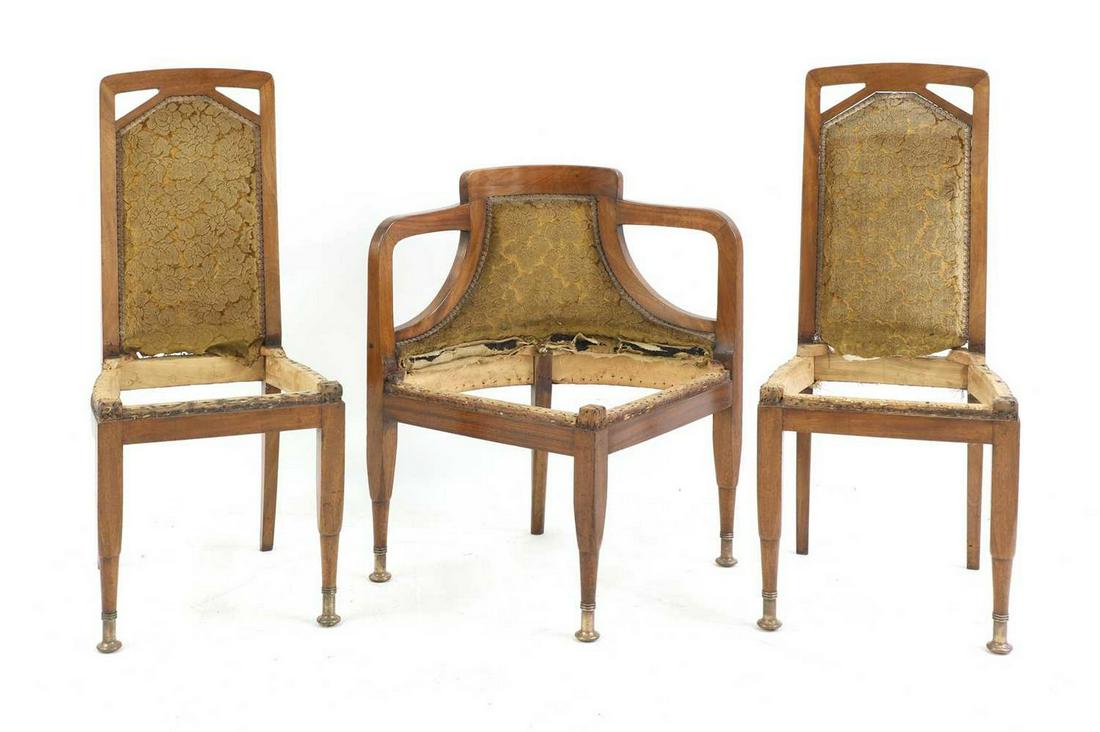 A pair of Austrian secessionist mahogany side chairs and a corner chair,: A pair of Austrian secessionist mahogany side chairs and a corner chair, A pair of Austrian secessionist mahogany side chairs and a corner chair, in the manner of Adolf Loos, each with a pierced and u