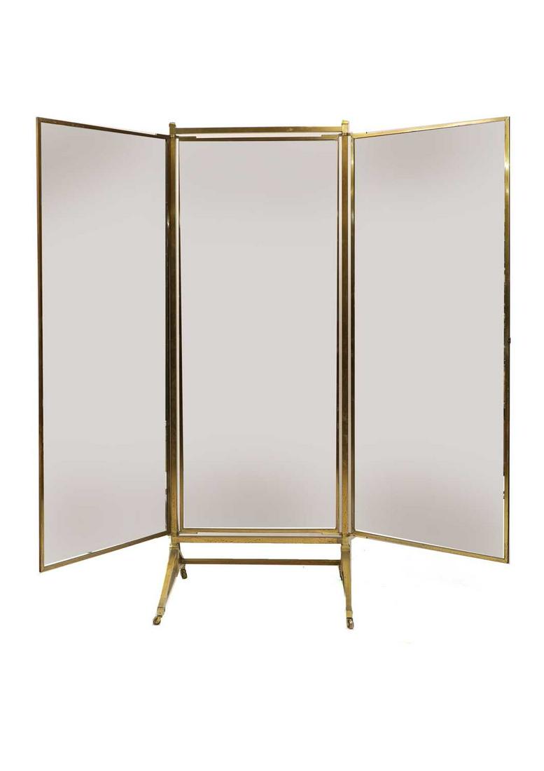 A French Art Deco brass triptych mirror,: A French Art Deco brass triptych mirror, A French Art Deco brass triptych mirror, 1930s, by Miroir Brot, with three rectangular mirror plates, raised on a triangular brass support, labelled with manuf