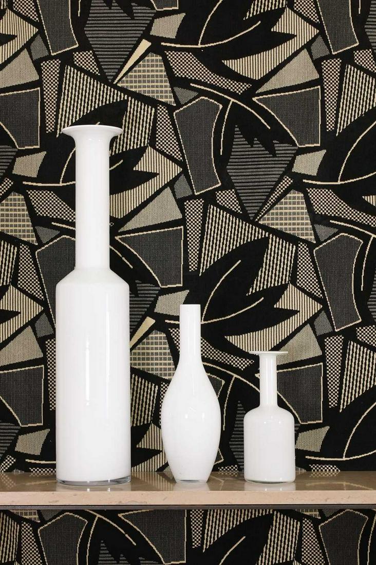 A collection of three Scandinavian milk glass bottle vases,: A collection of three Scandinavian milk glass bottle vases, A collection of three Scandinavian milk glass bottle vases, 1970s, all of various shouldered forms, to include one Holmegaard example, 83cm