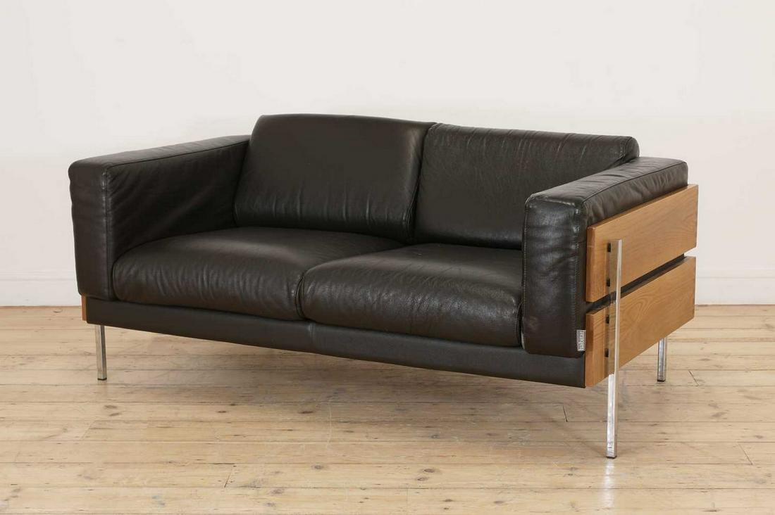 A 'Forum' settee,: A 'Forum' settee, A 'Forum' settee, originally designed by Robin Day, made by Habitat, with ash side panels, chrome supports and leather seats, 147cm wide 80cm deep 70cm high, seat 40cm high Buying th