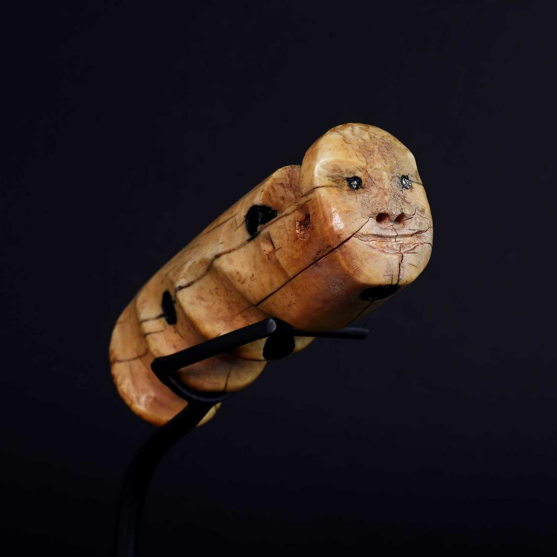 A Thule Eskimo shaman's drum handle, (1 of 4)