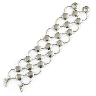 A sterling silver bracelet, by Georg Jensen,: A sterling silver bracelet, by Georg Jensen, A sterling silver bracelet, by Georg Jensen, designed by Regitze Overgaard, no. 464. Of lattice form, with circular solid and hoop links, to 'T' bar clasps