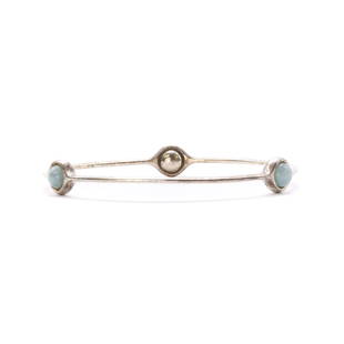 A sterling silver bangle, by Georg Jensen,: A sterling silver bangle, by Georg Jensen, A sterling silver bangle, by Georg Jensen, set with three aquamarine beads. No. 473, designed by Regitze Overgaard, hallmarked London 2021, maker's mark. Int