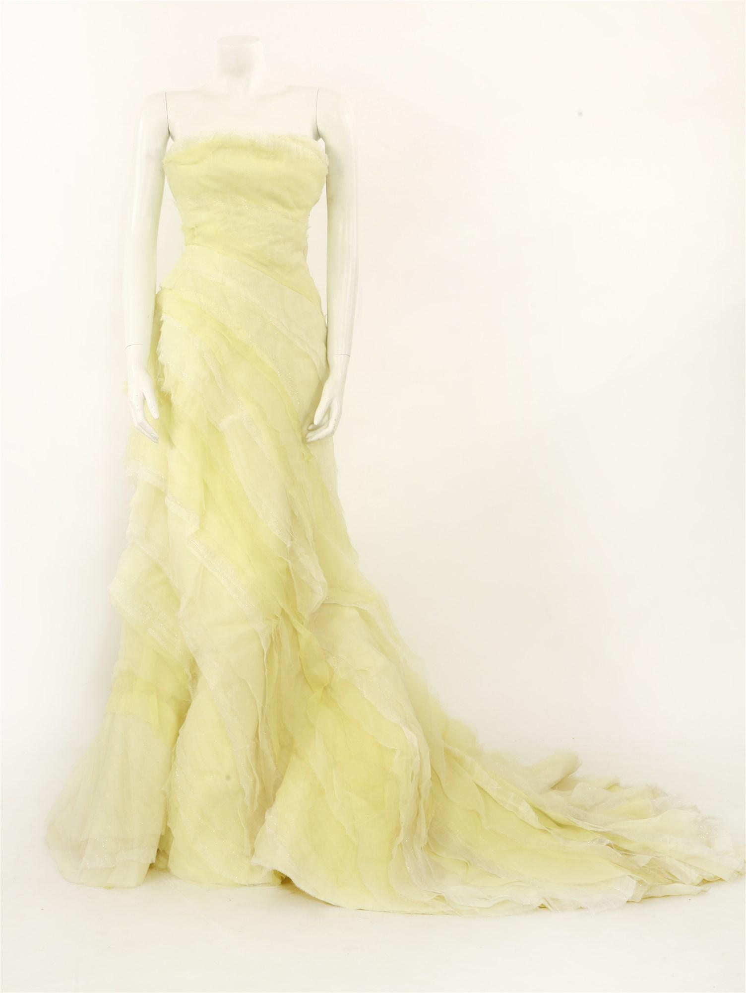 A Roberto Cavalli pale lime and cream couture strapless ballgown,: A Roberto Cavalli pale lime and cream couture strapless ballgown, A Roberto Cavalli pale lime and cream couture strapless ballgown, handmade in light organza silk muslin and silk, embroidered in part