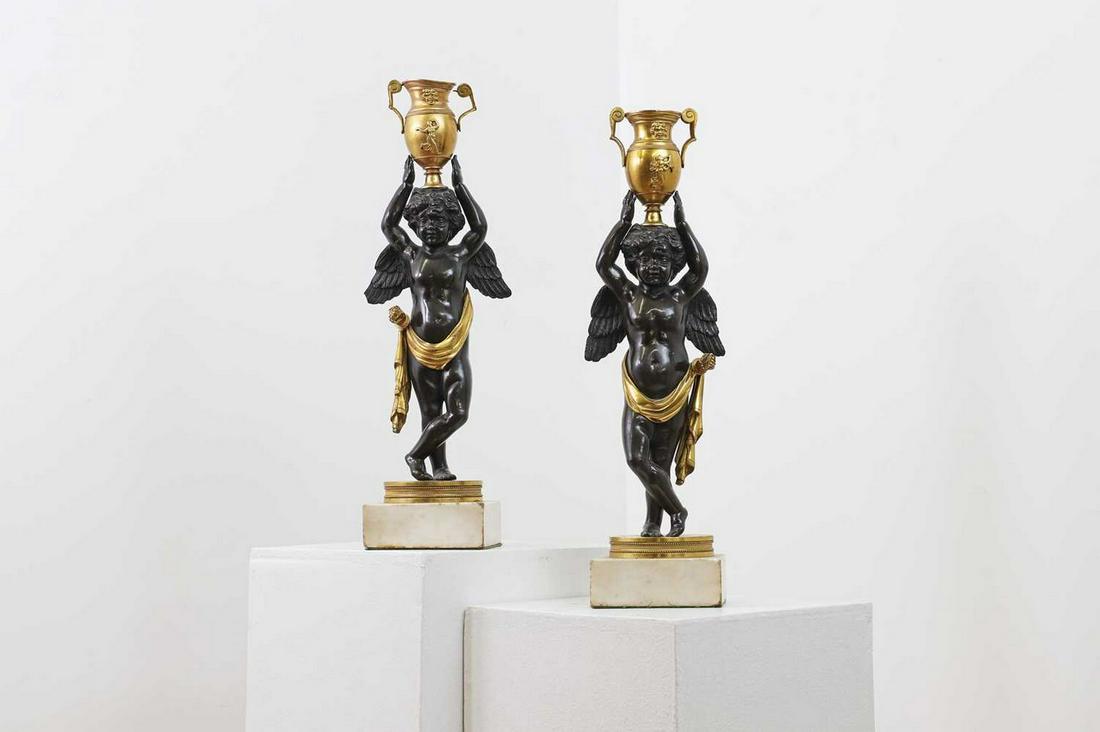 A pair of Directoire bronze and gilt candlesticks, (1 of 3)