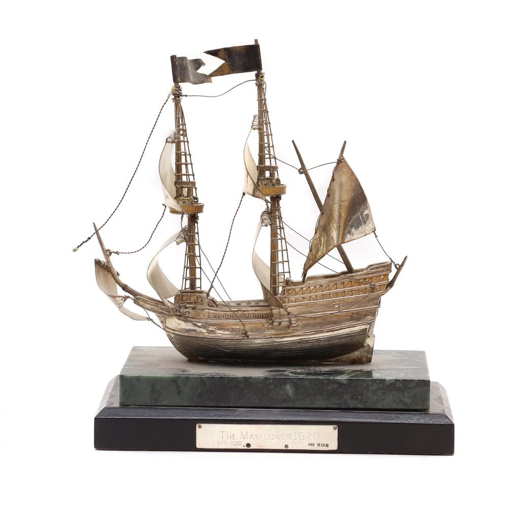 A silver model of The Mayflower,: A silver model of The Mayflower, A silver model of The Mayflower, by B-M, Birmingham 1989, with sails and rigging, mounted on a green marble base and ebonised plinth, with presentation plaque engraved