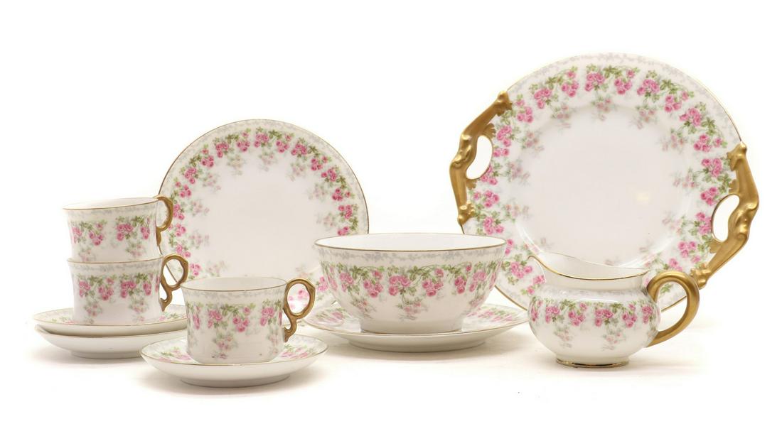A Bernardaud & Cie Limoges porcelain tea service: A Bernardaud & Cie Limoges porcelain tea service A Bernardaud & Cie Limoges porcelain tea service 20th century, for twelve settings, comprising teacups, 9.2cm wide, saucers, 12.8cm diameter, side plat