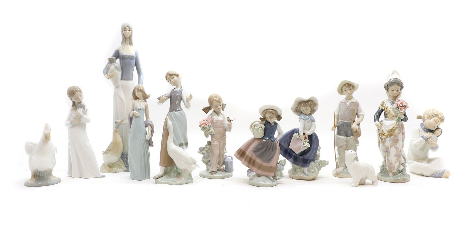 A collection of Lladro porcelain figures, (1 of 8)