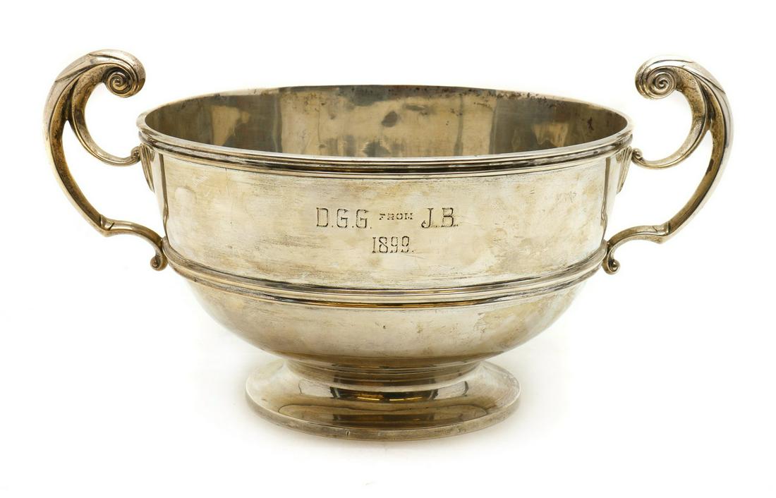 A silver rose bowl,: A silver rose bowl, A silver rose bowl, by Charles Stuart Harris, London 1899, with high scrolled handles, engraved 'DGG from J B 1899', 23.5cm diameter excluding handles 17cm high including handles 4
