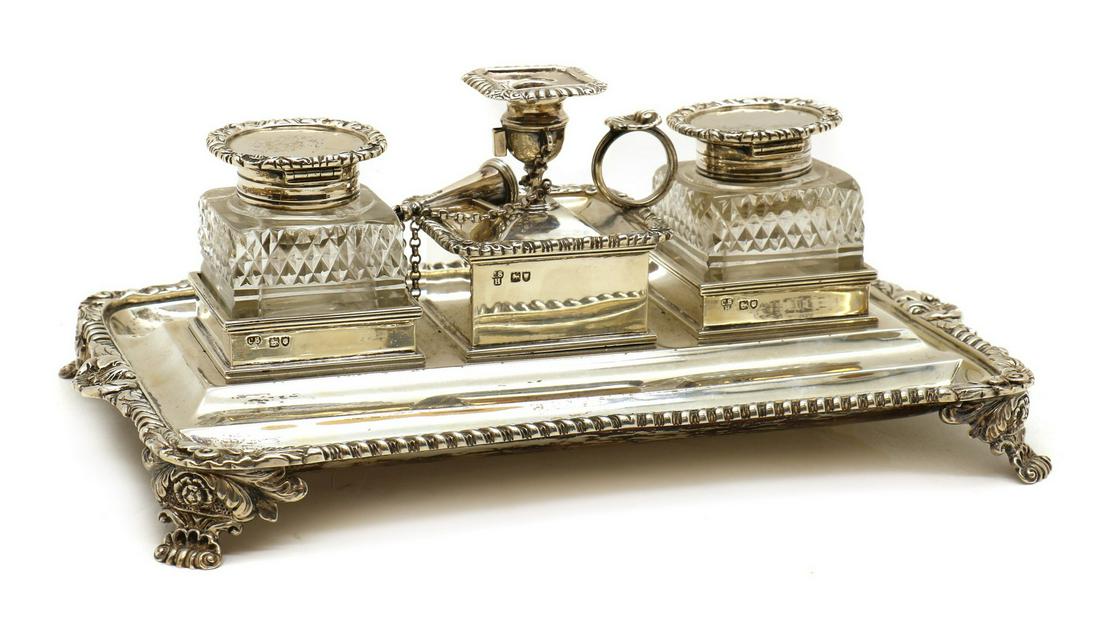A late Victorian silver desk stand: A late Victorian silver desk stand A late Victorian silver desk stand, by Charles Stuart Harris, London 1899, the top with two silver mounted and cut glass inkwells flanking a central chamber stick, t