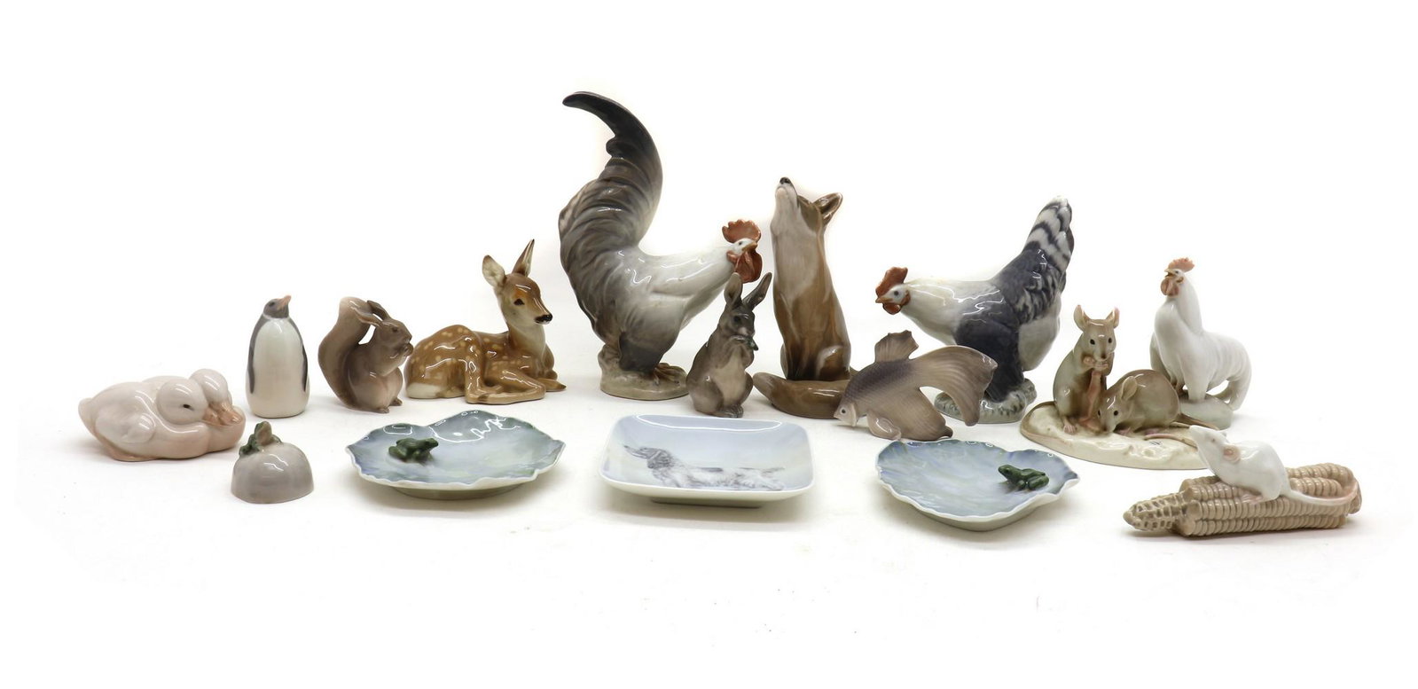 A collection of Royal Copenhagen porcelain figures: A collection of Royal Copenhagen porcelain figures A collection of Royal Copenhagen porcelain figures; comprising a cockerel, hen, bantam, fox, rabbit, squirrel, penguin, ducks, mouse on corn, fantail