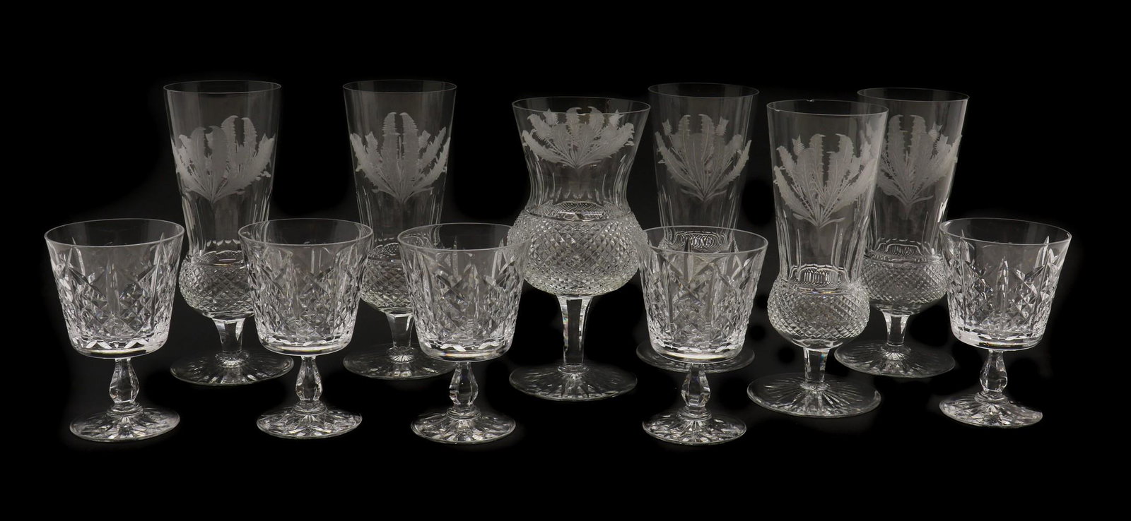 A set of six Edinburgh crystal 'Thistle' pattern glasses,: A set of six Edinburgh crystal 'Thistle' pattern glasses, A set of six Edinburgh crystal 'Thistle' pattern glasses, comprising five flutes and a wine glass, with etched thistles leading to a hobnail b