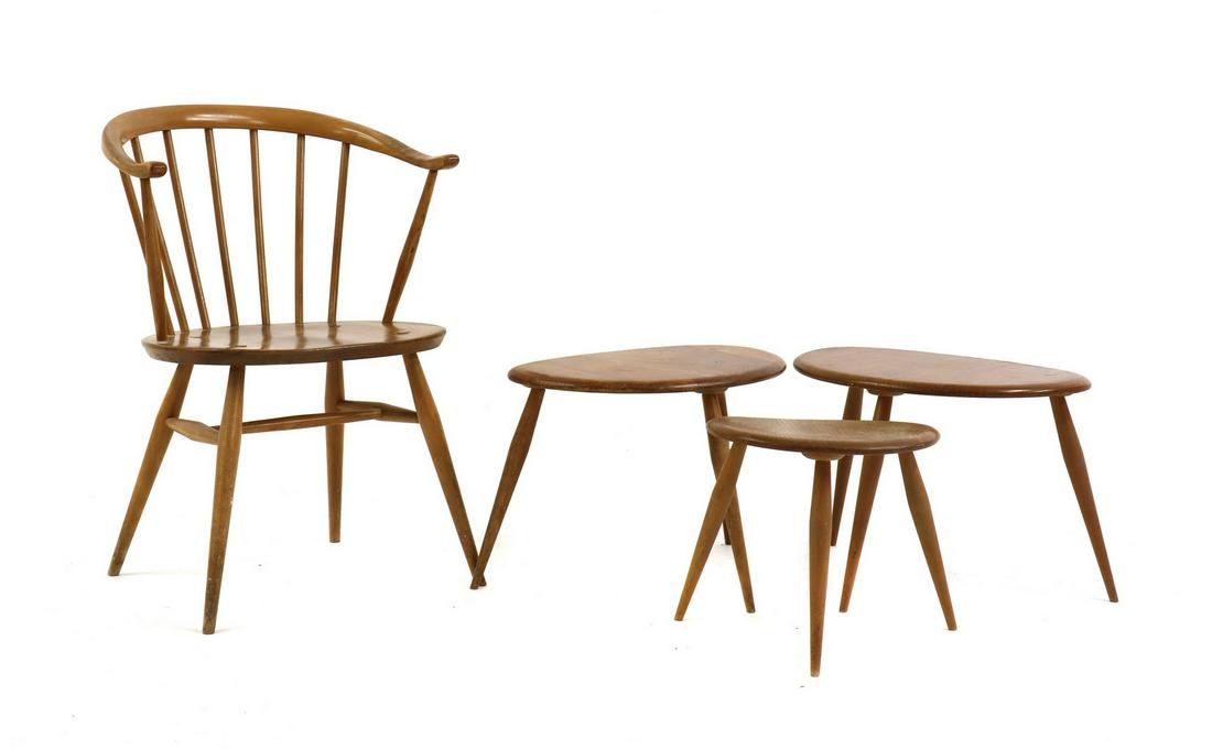 A group of three Ercol elm and beech 'Pebble' tables: A group of three Ercol elm and beech 'Pebble' tables A group of three Ercol elm and beech 'Pebble' tables, comprising two medium examples, 55cm wide 34cm deep 36cm high a smaller example, 42cm wide 24
