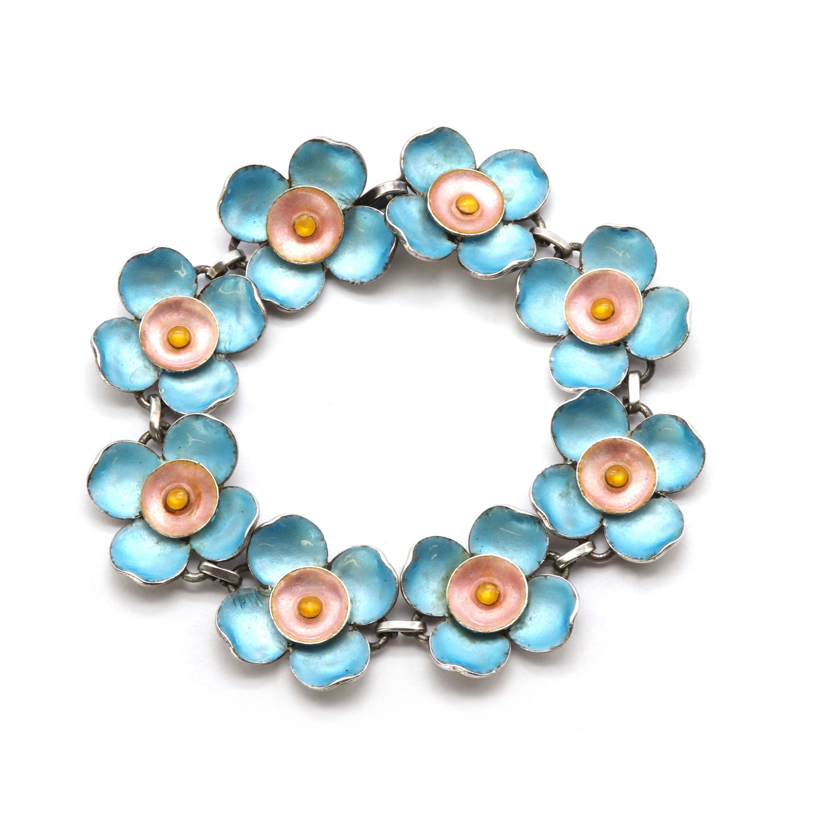 An Arts and Crafts silver enamel bracelet, by Bernard Instone,: An Arts and Crafts silver enamel bracelet, by Bernard Instone, An Arts and Crafts silver enamel bracelet, by Bernard Instone, composed of a series of blue, pink and yellow enamel flower heads, all joi