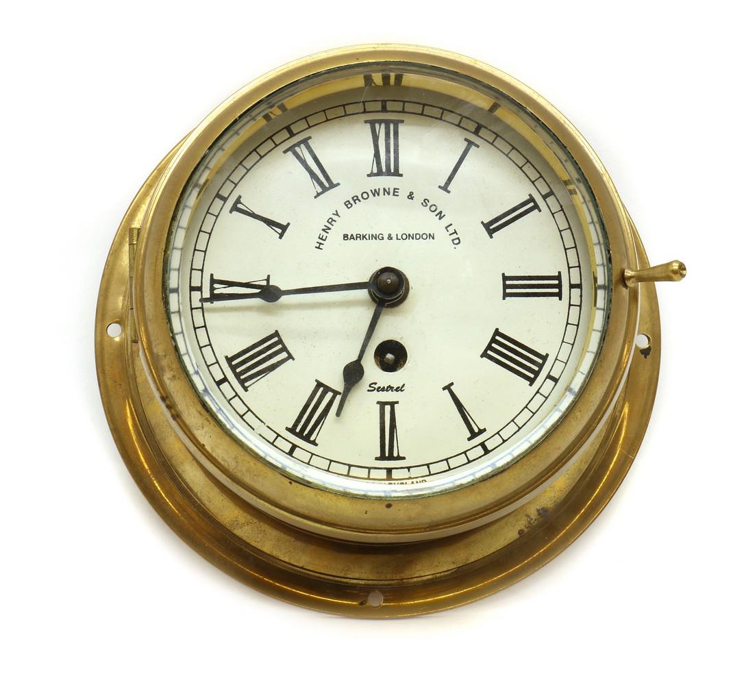 A brass bulkhead clock (1 of 3)