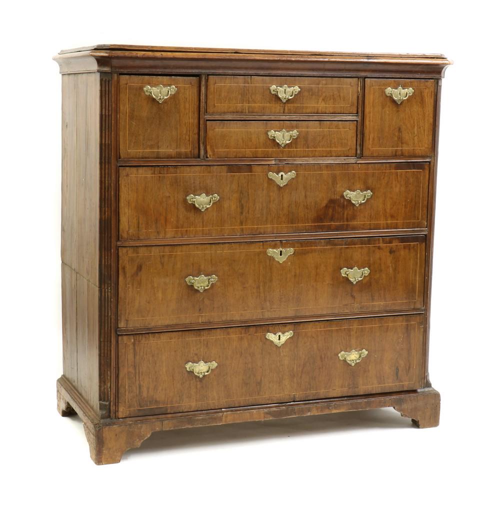 A walnut and pine chest of drawers,: A walnut and pine chest of drawers, A walnut and pine chest of drawers, 18th century, with canted reeded sides, with pine sides, on later bracket feet 100cm wide 49.5cm deep 102cm high