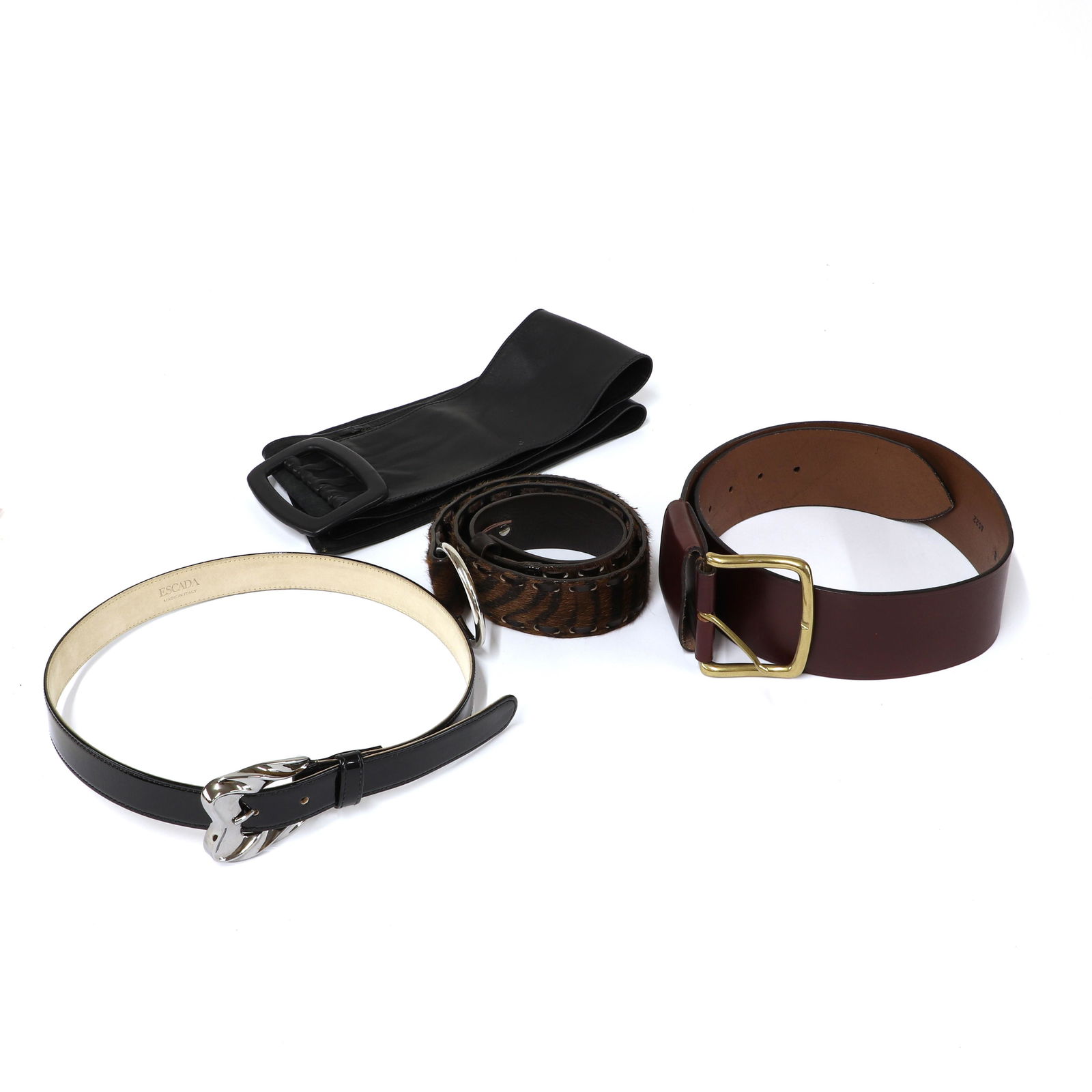 Four designer belts,: Four designer belts, Four designer belts, to include an Escada black patent leather belt with silver tone buckle, size 36, a Paul Costello wide brown leather belt, with brass tone buckle, size S, a Jo