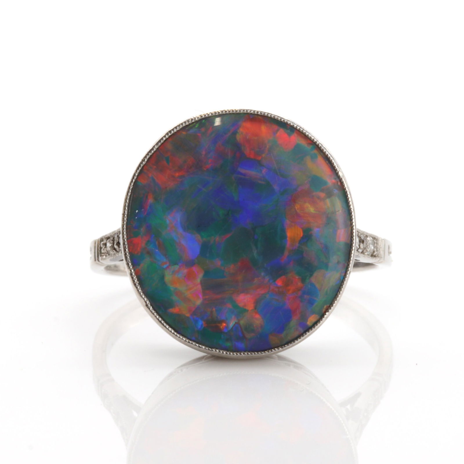 An Art Deco single stone black opal ring, (1 of 3)