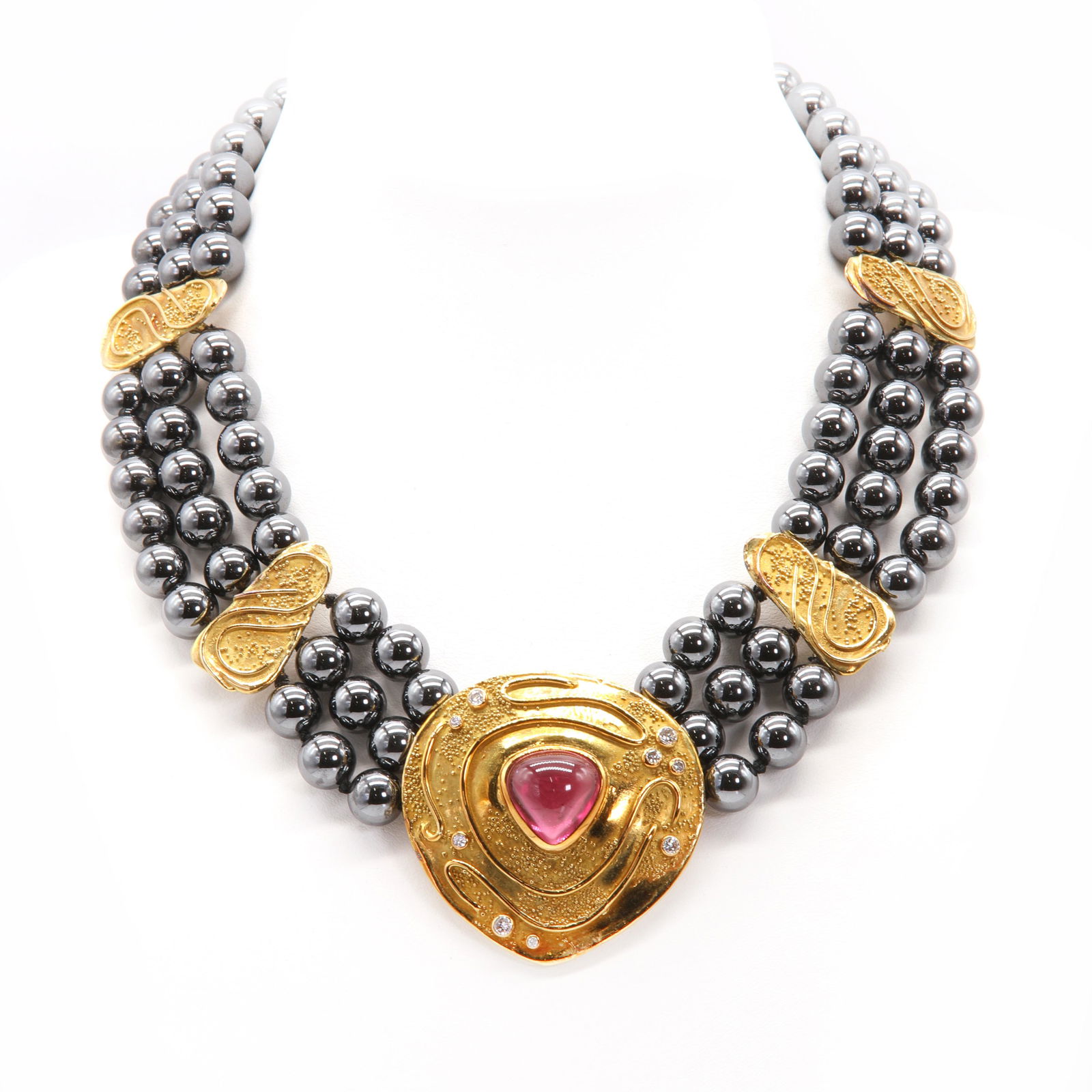A pink tourmaline and diamond three row haematite necklace, by Elizabeth Gage, c.1990, (1 of 2)