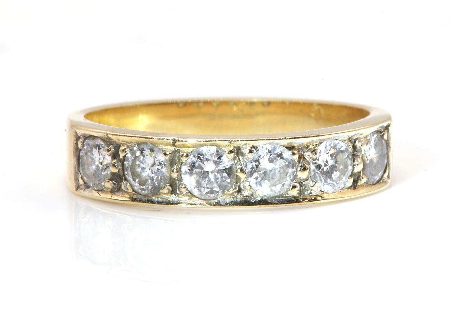 A six stone diamond half eternity ring, (1 of 3)