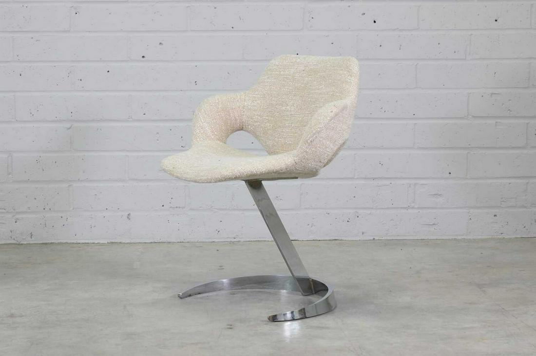 A 'Scimitar' desk chair,: A 'Scimitar' desk chair, A 'Scimitar' desk chair, 1970s, designed by Boris Tabacoff, recently reupholstered, with a chromed steel stand, 64cm wide 56cm deep 78cm high, seat 48cm high Condition Report: