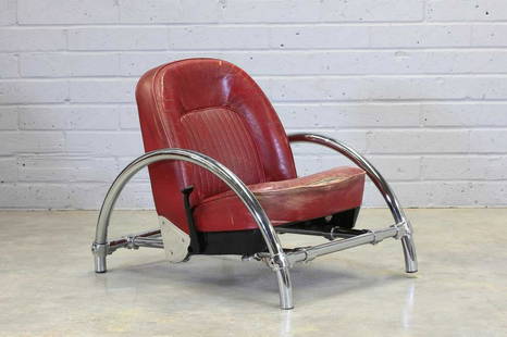 A 'Rover' armchair,: A 'Rover' armchair, A 'Rover' armchair, designed by Ron Arad in 1981 by One-Off, the ready-made car seat upholstered in red leather, suspended on a tubular metal frame, 69cm wide 90cm deep 77cm high P